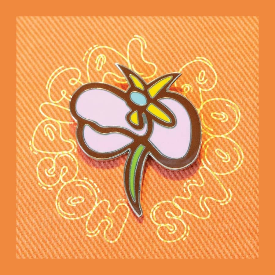 Hope Pin by Giles Deacon featuring abstract floral design on orange fabric