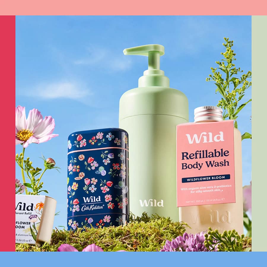 Wild deodorant and refillable body wash on a natural background with eco-friendly packaging.