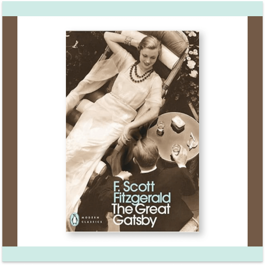 Penguin Modern Classics edition of The Great Gatsby by F. Scott Fitzgerald, showing a sepia-toned overhead photo of a woman reclining and a man seated at a table