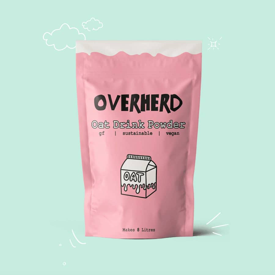 A pastel pink pouch of Overherd oat milk powder against a light green background. Vegan, gluten-free, and sustainable, this oat drink powder makes 8 litres of fresh oat milk. Get 15% off with our link!