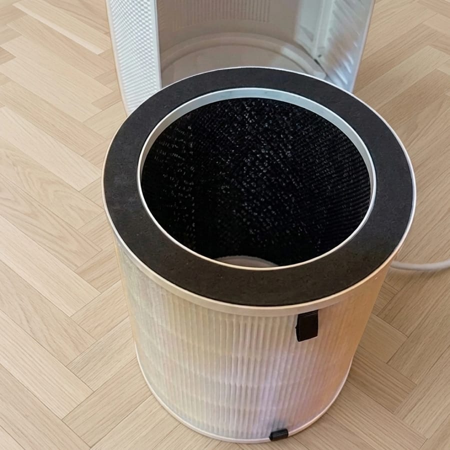 Sans Air Purifier Mini opened to show its HEPA 13 and activated carbon filter cartridge