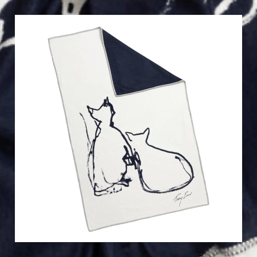 Cream recycled cotton blanket with navy line drawing of two cats and Tracey Emin signature, navy reverse side visible at corner.