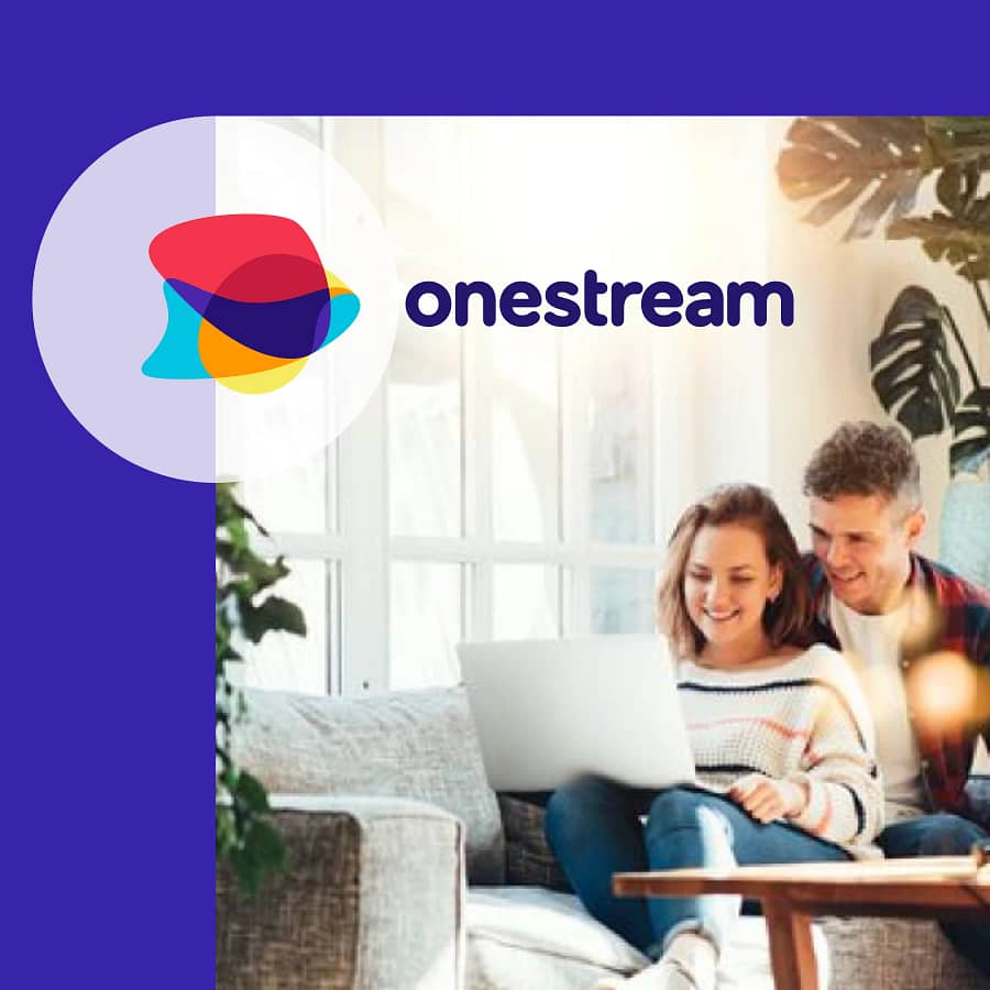 A happy family using laptops and tablets at home with fast Onestream Broadband. Sign up with referral code OS10208312 or our link to get £20 off your first bill and enjoy reliable, affordable internet.