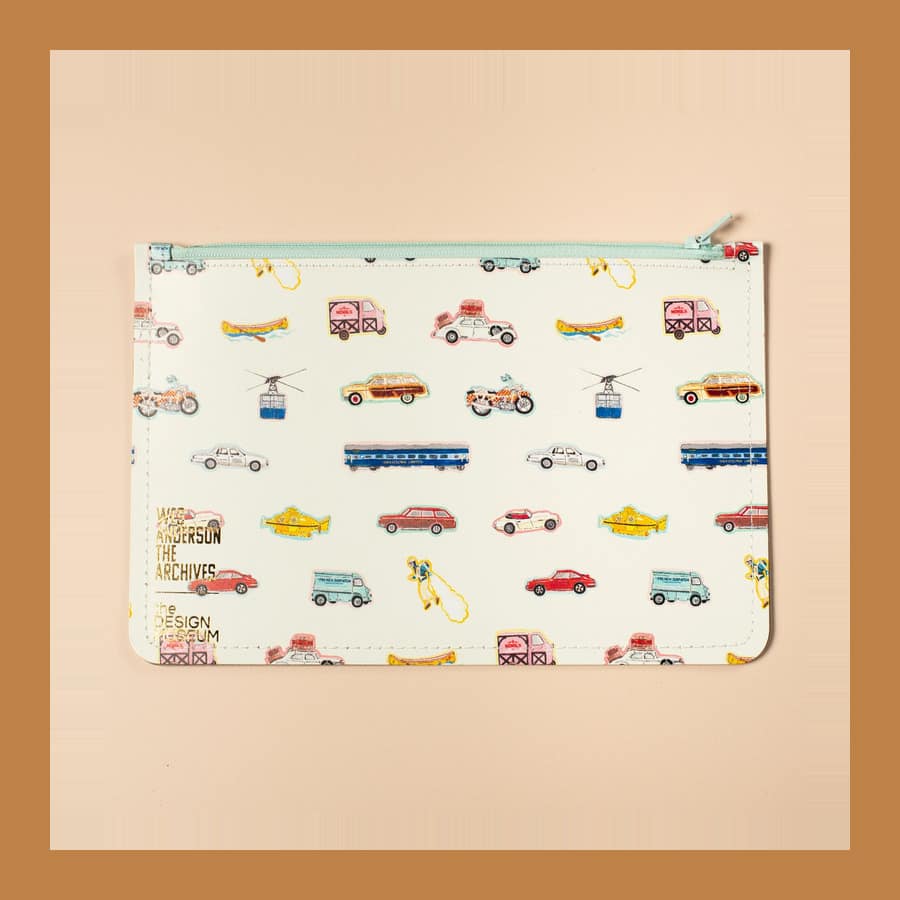 Wes Anderson Transport leather zip pouch printed with cars, buses and a train from his films
