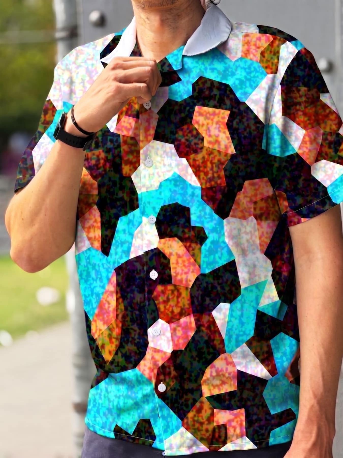 Close-up of the Digital Camouflage shirt's adversarial pattern in turquoise, orange, white and black.
